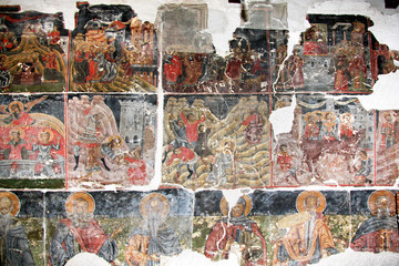 Ancient Byzantine fresco paintings on the wall in the old church.