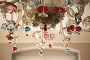 Chandelier made of glass with some colorful applications