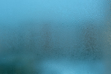 Misted glass background. Strong humidity in wintertime.