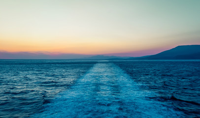 Fototapeta premium Track from cruise ship at sunset