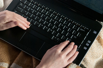 woman hands using laptop
