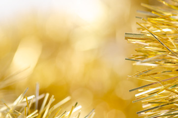 Gold tinsel Christmas new year sparkles macro blur background
