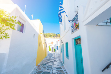 Street with flagstone pavement and traditional rustic houses in the village of Lefkes, Island of Paros, Greece