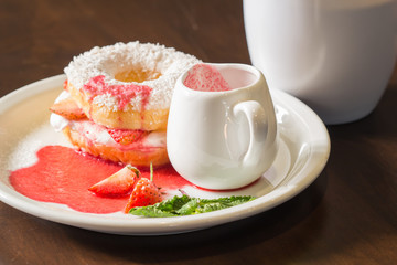 cup of tea and cake on wooden table