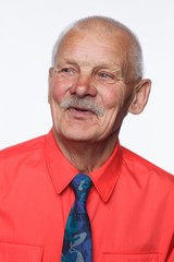 Handsome bearded senior man shows surprised smile grimace