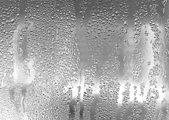 texture of a misted glass with a lot of drops and condensation flows