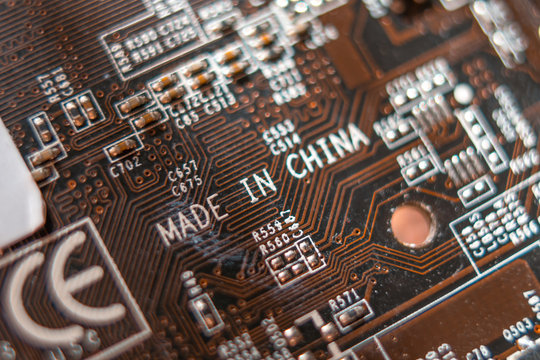 Brown motherboard with incription "Made in China"