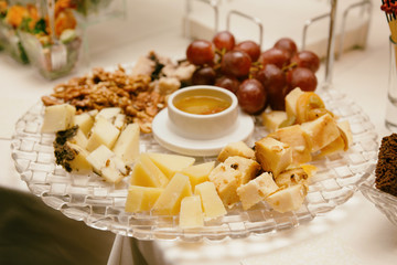 Cheese platter on banquet table, toned