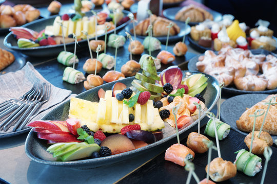 Various food on catering table, toned