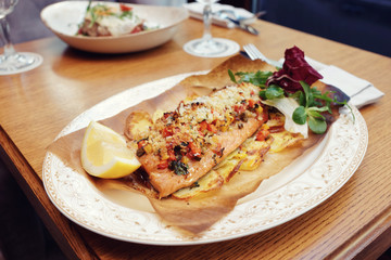 Baked salmon with vegetables, Italian dish, toned