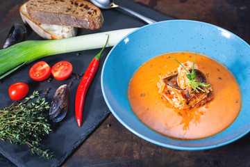 Mediterranean tomato seafood soup in plate