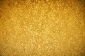 Gold background texture. Wallpaper on the wall. Element of design.