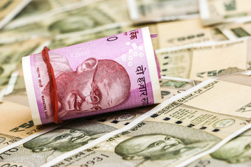 Close up view of brand new indian 2000 rupees banknotes. 500 rupee banknotes in background.