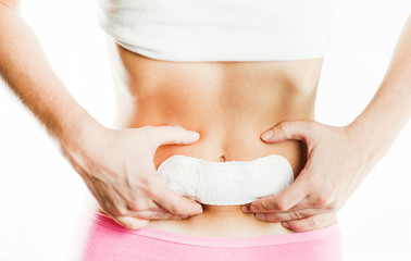 Women Period Product. Closeup Of Beautiful Fit Slim Female Body In White Underwear Holding Sanitary Napkin, Towel In Hand. Woman Holding Clean Period Pad. Feminine Intimate Hygiene. High Resolution