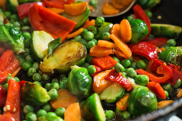 Vegetarian food fried vegetables, brussels sprouts and carrots
