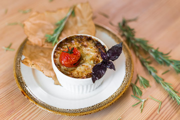 Julienne with mushrooms, cooked tomato cherry, cheese and rosemary