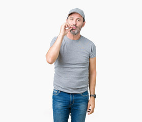 Handsome middle age hoary senior man wearing sport cap over isolated background mouth and lips shut...