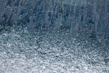 the texture of the snow,the frozen glass of the car