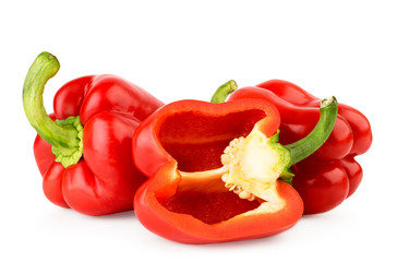Red bell pepper and half on a white. Isolated.