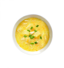 Cheese soup with chicken, potatoes and turmeric isolated with clipping path