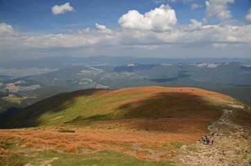 The stone peaks of the mountain ranges of Hoverla Ukrainian Carpathian mountains covered with ancient conifer forests