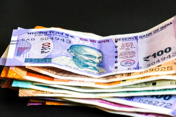 Close up view of brand new indian 50, 100, 200, 500, 2000 rupees banknotes.