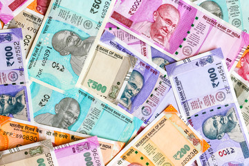 Fototapeta na wymiar Close up view of brand new indian 50, 100, 200, 500, 2000 rupees banknotes. Colorful сash money background.