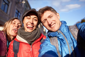 couple happy tourists making selfie on the streets of Lviv