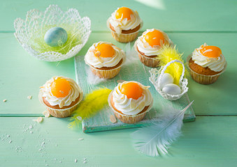 Easter dessert. Cupcake with cream and apricot