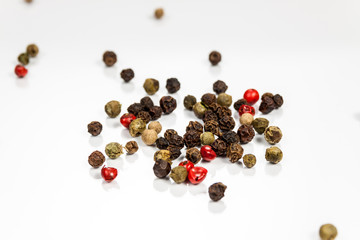 Pepper beans isolated on reflective white surface