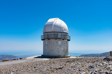 Mount Skinakas Peak astronomical observatory dome overlooking Heraklion city coastline, Crete, Greece. Sky astrophysical observatory at 2000m on Psiloritis mountain range. Astronomy concept. © Stockphototrends