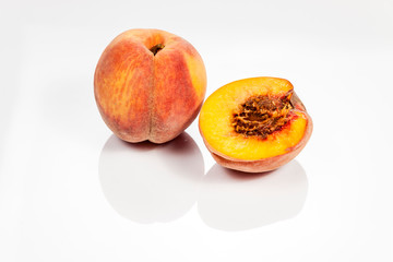 Peach isolated on white reflective background