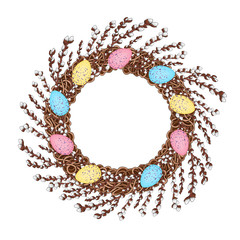 A wreath of young willow branches, decorated with colorful Easter eggs. Symbol of spring and Easter. 