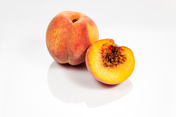 Peach isolated on white reflective background
