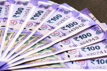 Close up view of brand new indian one hundred rupees banknotes.