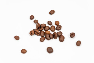 Roasted coffee beans isolated on white background, angle view