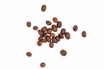 Roasted coffee beans isolated on white background, angle view