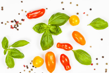 Basil, pepper and cherry tomatoes composition, isolated on white background