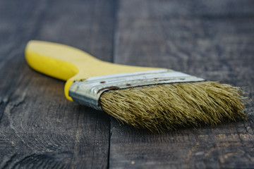 yellow tassel on wooden background