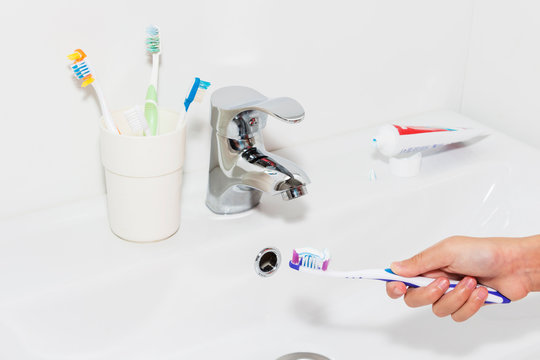 Toothpaste on a toothbrush, close-up. teeth care.