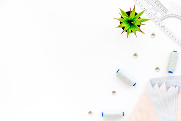 Tailor shop with thread, scissors, fabric. Sewing as hobby. White background top view mockup