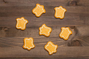 Christmas gingerbread cookies with frosting isolated on wooden background