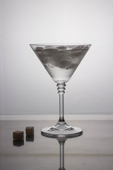 cocktail glass with drink on a light background