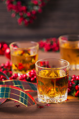 Whiskey, brandy or liquor shot and Christmas decorations