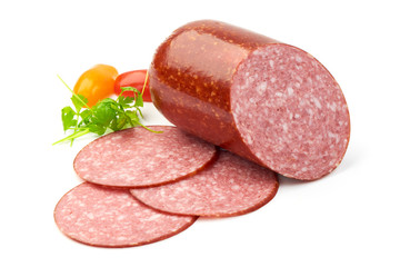 Salami with Slices, herbs and tomatoes, isolated on a white background. Close-up