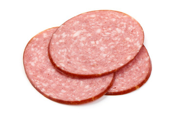 Thinly Sliced Salami, isolated on a white background. Close-up