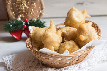 Close up of a Tipical christmas Italian food called pettole on light wooden background