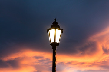 Fototapeta na wymiar street lamp on background of blue sky