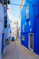 Fototapeta na wymiar Blue and white houses in historical district of Chelva, Valencian Community, Spain