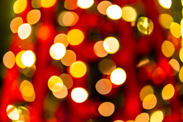 Christmas home room with tree and festive bokeh lighting, blurred holiday background